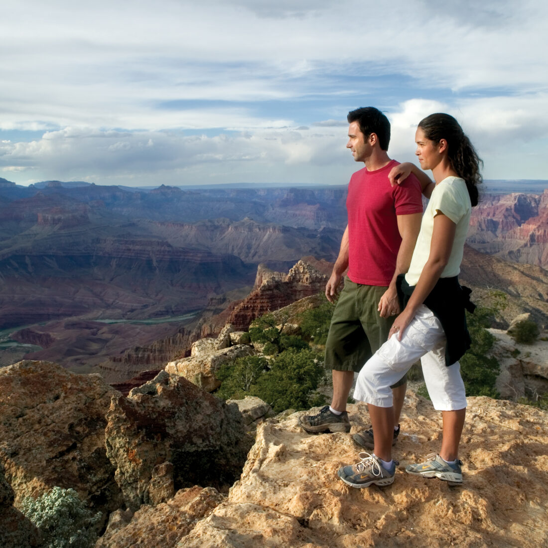 Couple overlooking Grand Canyon