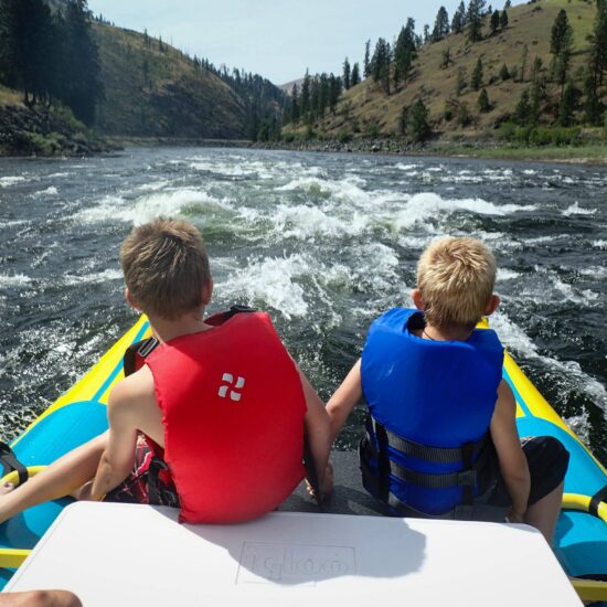 Two kids on kayak in Idaho